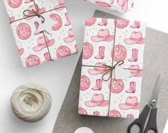 May include: Gift-wrapped presents with a pink cowboy hat, disco ball, and boot pattern. The gifts are tied with twine and have blank tags. A ball of twine, scissors, and blank tags are also visible.