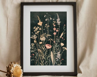 May include: A framed botanical print with a dark background, showcasing wildflowers in pink, cream, and yellow. The artwork is in a black frame and includes the text "BLACK VEIL VAULT".