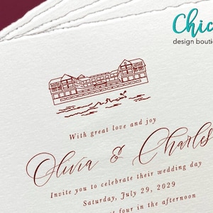 May include: A wedding invitation with a red illustration of a building with a water view. The text reads "With great love and joy Olivia & Charles Invite you to celebrate their wedding day Saturday, July 29, 2029 four in the afternoon".