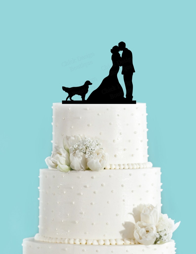 Gifts For Golden Retriever Owners - Wedding cake topper of couple kissing with Golden Retriever.