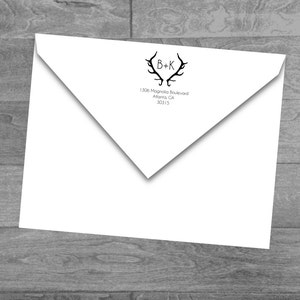 Puede incluir: Sobre blanco con un diseño de asta de ciervo en blanco y negro y el texto "B+K" y "1306 Magnolia Boulevard Atlanta, GA 30315".