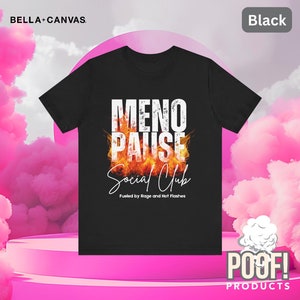 May include: Black t-shirt with a white graphic that says "Meno Pause Social Club" with flames behind the text. The text below the graphic says "Fueled by Rage and Hot Flashes".