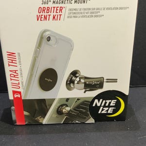 May include: A product box for a Steelie Orbiter Vent Kit, a 360-degree magnetic mount. The box is red and white with product images and the Nite Ize logo. The kit includes a phone mount and vent clip.