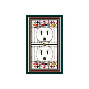 May include: A white double electrical outlet with a decorative cover featuring a colorful geometric design in shades of red, orange, yellow, blue, and green.