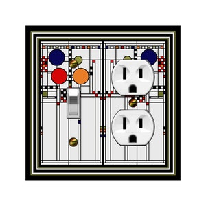 May include: A decorative light switch and outlet cover with a geometric design. The cover features a white background with a black border and colorful circles and rectangles in red, orange, blue, and green. Includes a silver switch and two white outlets.