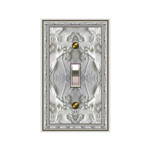 May include: A decorative light switch cover with a floral embossed design. The cover is primarily silver with a detailed pattern of flowers and leaves. The switch itself is a silver toggle, and the cover is framed with a brown and silver border.