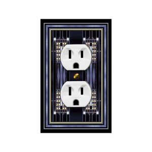 May include: A white electrical outlet with two plugs, framed in a black and blue geometric design.