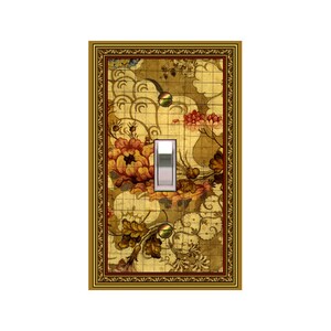 May include: Decorative light switch cover with a floral design. The cover features a gold frame and a central switch. The background has a pattern of flowers in shades of red, orange, and yellow, with a grid-like pattern.