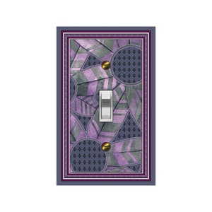 May include: A light switch cover with a geometric design in shades of purple and gray. The design features circles, triangles, and lines. The switch is white.