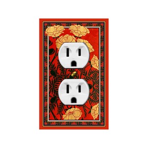 May include: A red and gold floral patterned outlet cover with two white electrical outlets.