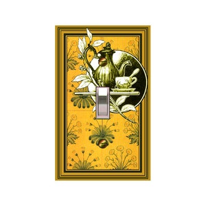 May include: A light switch cover with a vintage illustration of a teapot, teacup, and saucer on a yellow background with a green floral pattern.