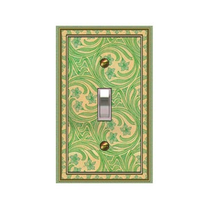 May include: A light switch cover with a green and cream floral pattern. The cover has a gold border and a white light switch.