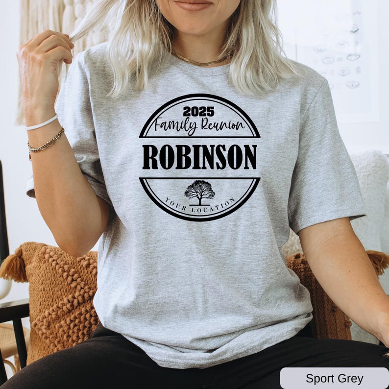 a woman sitting in a chair with a t - shirt on