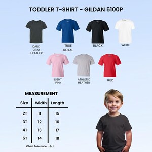 May include: A collection of Gildan 5100P toddler t-shirts in dark gray heather, true royal, black, white, light pink, athletic heather, and red. A measurement chart lists sizes 2T through 5T with widths from 11 to 14 inches and lengths from 15 to 18 inches.