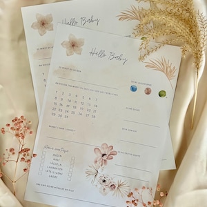 May include: A printable baby shower game with a floral design. The game asks guests to guess the baby's birth date, eye color, weight, and first words. The game also includes a section for guests to write down their wishes for the baby.