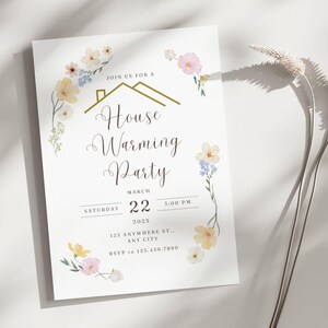 May include: A white card with a floral border and gold lettering announcing a housewarming party on Saturday, 22nd March at 3:00 PM. The invitation includes the address and RSVP information.