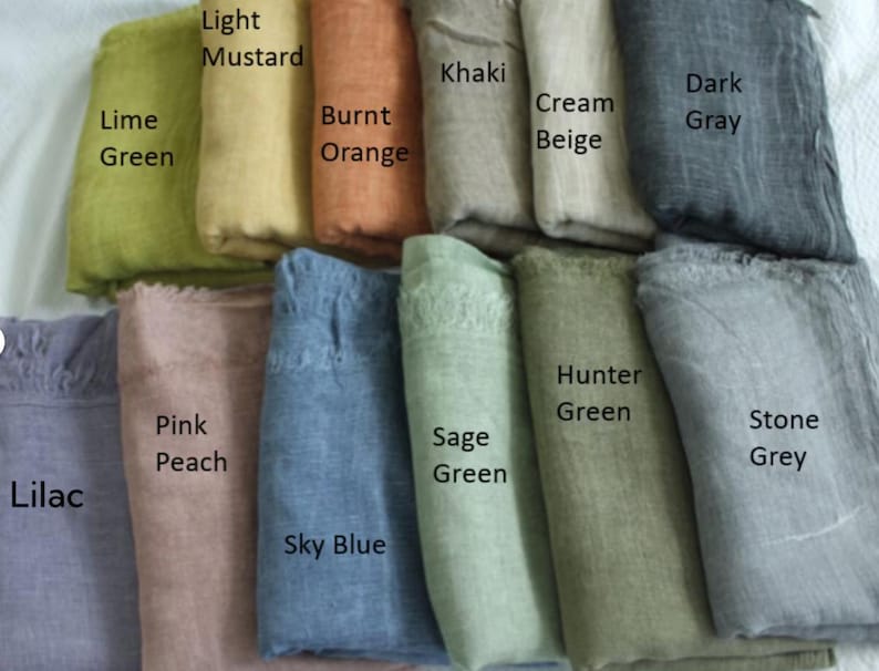 May include: A collection of 12 fabric swatches in various colours, including lime green, light mustard, burnt orange, khaki, cream beige, dark grey, pink peach, lilac, sage green, sky blue, hunter green, and stone grey.