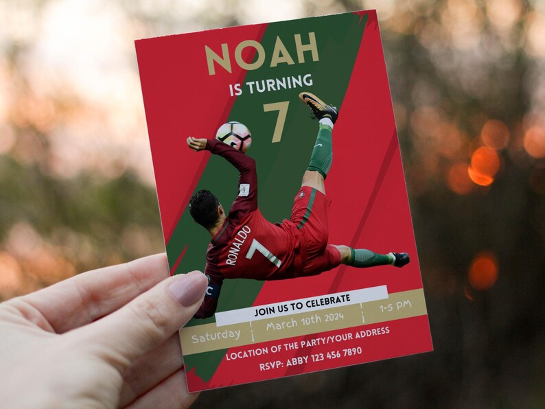 May include: Red and green soccer-themed birthday invitation for a boy turning seven. The invitation features a photo of a soccer player in a red and green uniform with the number seven on the back. The text on the invitation reads "Noah is turning 7" and includes details about the party, including the date, time, and RSVP information.