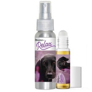 May include: Two bottles of dog aromatherapy oil, one in a spray bottle and one in a roller bottle. Both bottles have a silver label with a black dog on it and the text "The Blissful Dog Relax Dog Aromatherapy".
