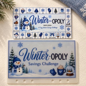 May include: Two rectangular Winter-opoly savings challenge cards featuring blue and white winter themes. The top card is a game board with dollar amounts and icons. The bottom card is a savings tracker with a snowman, mug, and text.