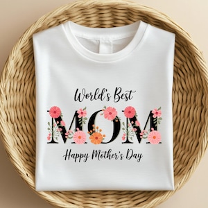 May include: White t-shirt with a floral design spelling out "World's Best MOM" with the text "Happy Mother's Day" below.