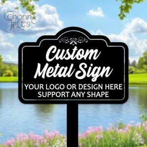 May include: A black custom metal sign with white text reading "Custom Metal Sign." The sign also states "Your logo or design here, support any shape." The sign is mounted on a black post and set in a garden.