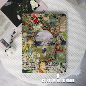 May include: A colorful journal cover with a collage of flowers, butterflies, and a quote that reads "Go where you feel the most alive". The journal cover is decorated with a whimsical, vintage aesthetic.