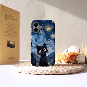 May include: A smartphone case with a black cat design set against a swirling night sky, inspired by Van Gogh's "Starry Night". The case has a smooth finish and is designed to fit a mobile phone. The design features a black cat.