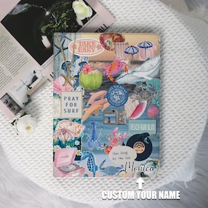 May include: A notebook with a collage design featuring ocean-themed illustrations. The design includes images of a whale, dolphins, seashells, and the text "Pray for Surf" and "Beach Bum Blvd". The notebook has the name "Monica" and the text "Custom Your Name".