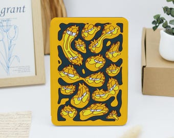 May include: A yellow and black phone case with a repeating pattern of Garfield's face in different expressions.