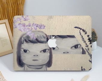 May include: A beige laptop case featuring a stylized illustration of a girl's face with dark hair and eyes. Lavender flowers and foliage are painted on the case. The Apple logo is visible.