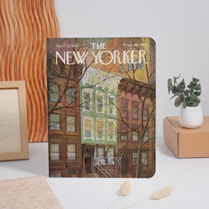 May include: The New Yorker magazine cover from April 12, 1969, featuring an illustration of a city street scene with brownstone buildings and trees. The price is 50 cents.