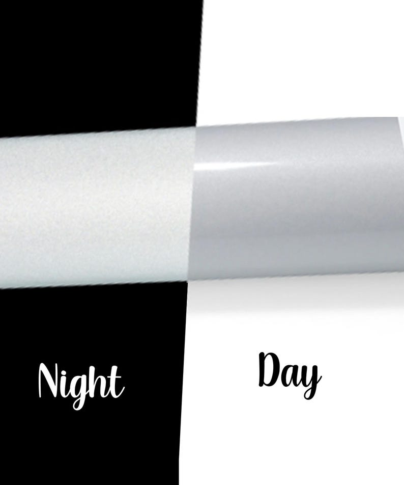 May include: A split image with a black and white background. The left side is black with the word "Night" in white script. The right side is white with the word "Day" in black script. The image shows a roll of white material.