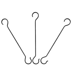 May include: Three black metal plant hangers, each with a hook at the top and a curved design at the bottom. These hangers are designed for suspending plants or decorative items. The minimalist design suits various interior styles.