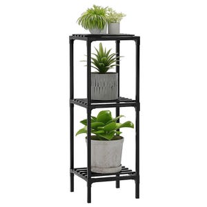 May include: A black, three-tiered plant stand with various potted plants. The stand has a square frame with slatted shelves. The plants include a snake plant, a succulent, and other greenery in gray and white pots.