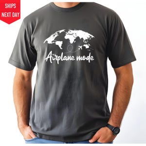 a man wearing a t - shirt that says airplane made