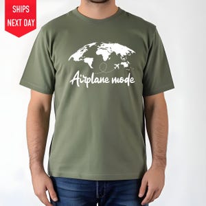 a man wearing a t - shirt that says airplane mode