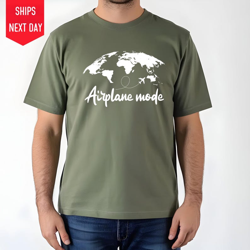 a man wearing a t - shirt that says airplane mode