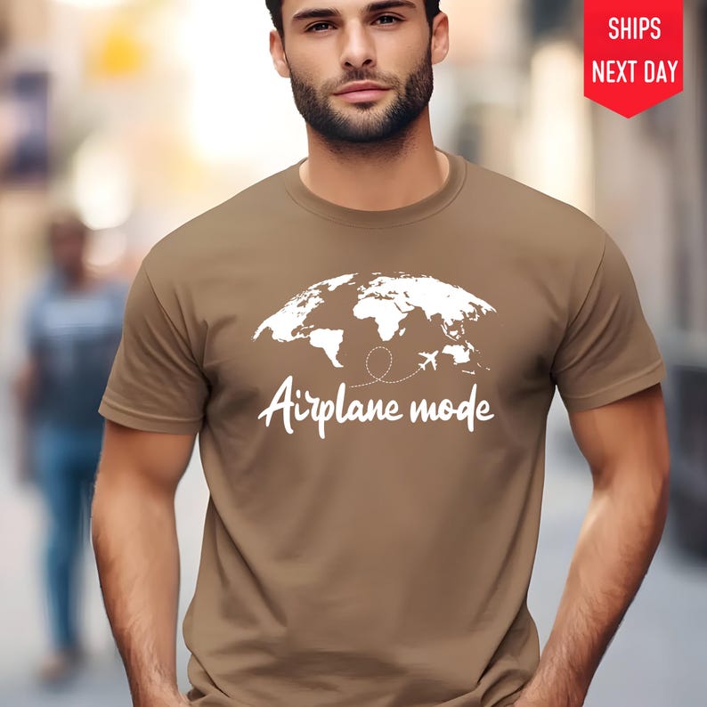 a man wearing a t - shirt that says airplane mode