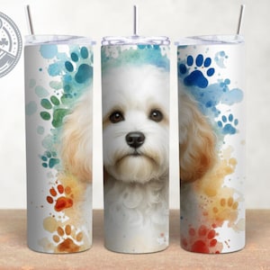 May include: Three stainless steel tumblers with a watercolor design featuring a white dog with brown ears and blue paw prints.