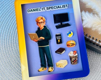 May include: A framed illustration featuring a cartoon IT specialist holding a laptop. The frame has a gradient of yellow, orange, and blue. The illustration includes a computer, keyboard, energy drink, burger, and books. Text at the top reads "DANIEL IT SPECIALIST."