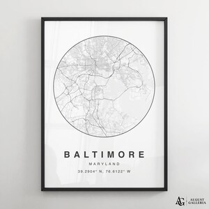 May include: Black and white map print of Baltimore, Maryland. The map is in a circle with the city name and coordinates below. The print is framed in a black frame.
