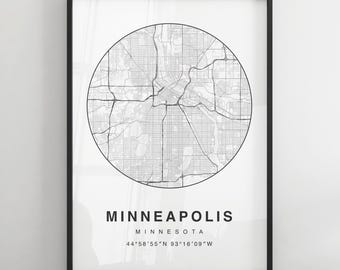 May include: A black and white map of Minneapolis, Minnesota, with the city's name and coordinates printed below. The map is in a circular frame and is printed on a white background.