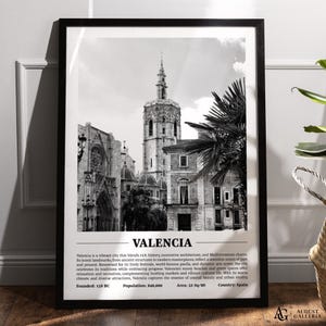 May include: A black and white photograph of Valencia, Spain. The image shows a view of the city's historic architecture, including a tall church tower and palm trees. The text below the image reads "Valencia", "Founded: 135 BC", "Population: 840,000", "Area: 52 Sq/Mi", and "Country: Spain".