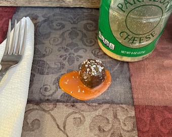 Fake Meatball in a Puddle of Sauce Food Prop