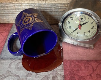 Fake Spilled Mug of Black Coffee in a Monroe County Sheriff’s Mug Fun Photo Staging Prop