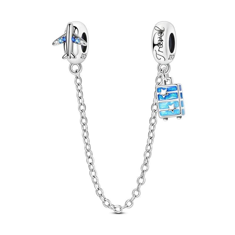 May include: A silver charm bracelet safety chain with two travel-themed charms. One charm is an airplane with blue accents, and the other is a blue suitcase with star details. The chain connects the charms.