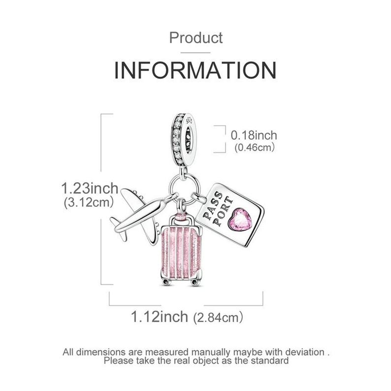 May include: A silver charm with travel-themed pendants. The charm includes a small airplane, a pink suitcase, and a passport with a heart. The charm is 1.23 inches (3.12 cm) long, 1.12 inches (2.84 cm) wide, and 0.18 inches (0.46 cm) thick.