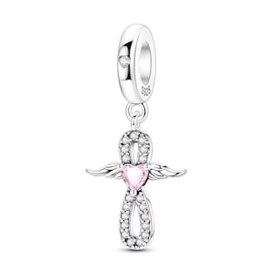 May include: A silver charm with an angel wing design. The charm features a pink heart-shaped stone in the center, surrounded by clear stones. The top of the charm has a small clear stone and the text "S925".