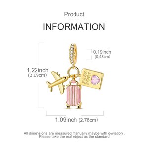 May include: A gold-colored charm with a travel theme. It features a small airplane, a pink suitcase, and a passport with a heart-shaped gem. The charm is 1.22 inches (3.09cm) long and 1.09 inches (2.76cm) wide.